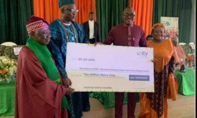From Right: Managing Director/CEO of Unity Bank Plc, Mrs Oluwatomi Somefun; Regional Manager, Unity Bank, Mr Segun Olarenwaju presenting cheque to the Onifiditi of Fiditi, Oba Sakiru Oyewole Adekola-Oyelere, Ajani-Eedu II and the Chairman of the Committee, Professor John Oluokun during the during the official launch and Groundbreaking of National Open University of Nigeria, Fiditi Study Centre on Saturday at Fiditi Grammar School, Oyo state.